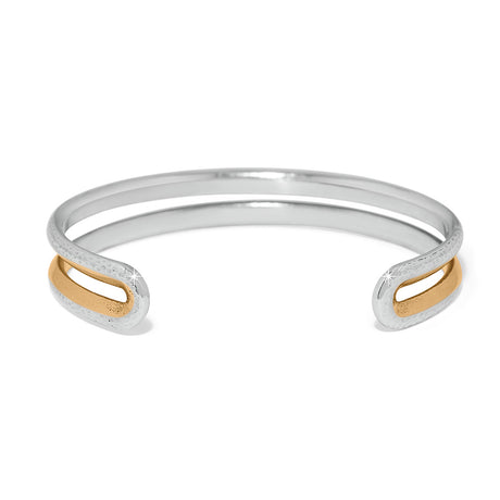Silver and gold bracelet on a white background