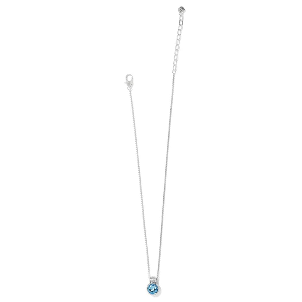 Necklace with a blue gemstone pendant on a white background