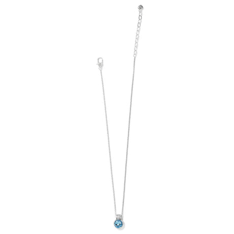 Necklace with a blue gemstone pendant on a white background