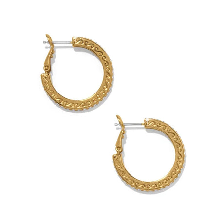 Gold hoop earrings with intricate designs on a white background