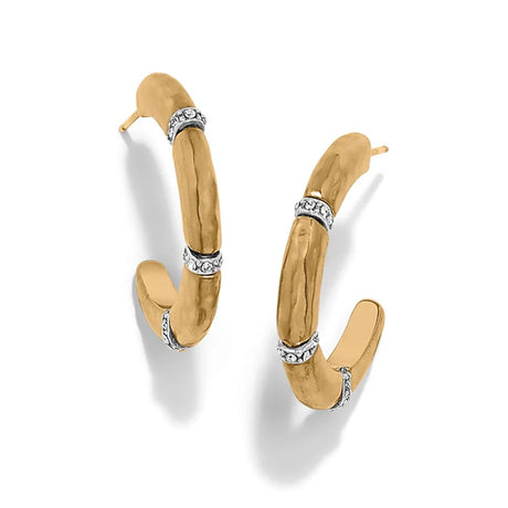 Gold hoop earrings with embedded diamonds on a white background