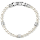 A pearl bracelet with a silver-toned clasp and decorative crystal-encrusted spacer beads, shown on a plain white background.