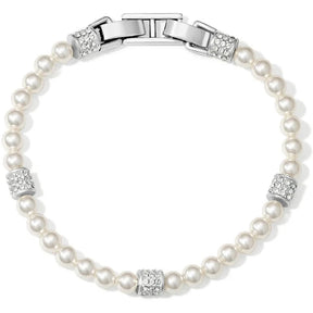 A pearl bracelet with a silver-toned clasp and decorative crystal-encrusted spacer beads, shown on a plain white background.