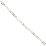 A pearl bracelet with silver-tone square links and clear crystal accents, shown diagonally on a plain white background.