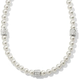 Pearl necklace with silver clasp on a white background