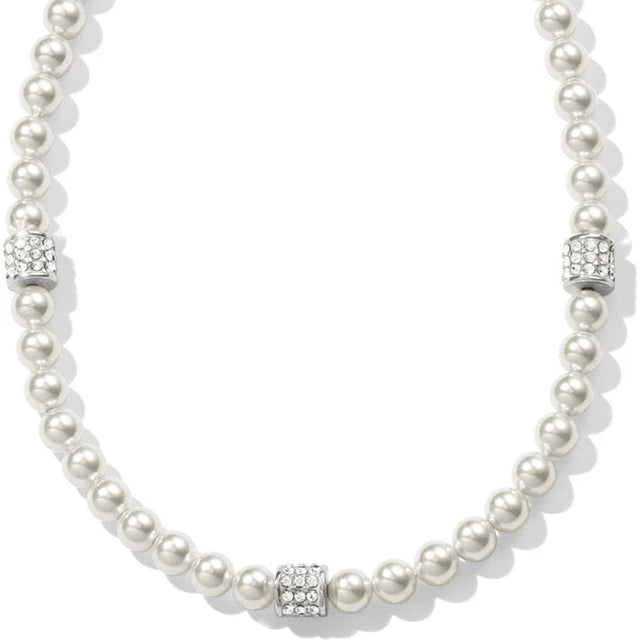Pearl necklace with silver clasp on a white background