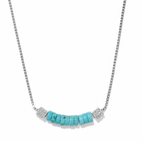 A silver box chain necklace featuring a curved bar of turquoise-colored beads in the center, flanked by two square silver bezel-set crystal accents, shown on a plain white background.