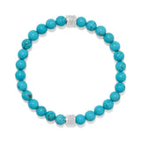 A beaded stretch bracelet made of round turquoise-blue beads with two silver-toned spacer beads set with small clear stones, shown on a plain white background.
