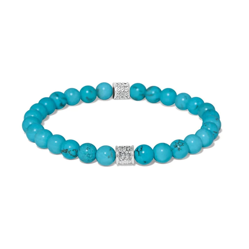 A turquoise beaded stretch bracelet with two silver square charms set with small clear stones, displayed on a clean white background.