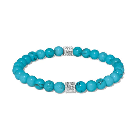 A turquoise beaded stretch bracelet with two silver square charms set with small clear stones, displayed on a clean white background.
