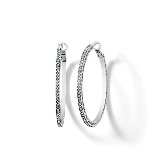 Pair of silver hoop earrings on a white background