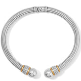 Silver bracelet with spherical ends and gold accents on a white background