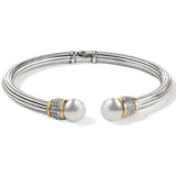 Silver bracelet with pearl-like beads on a white background