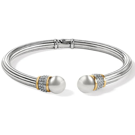 Silver bracelet with pearl-like beads on a white background