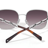 Sunglasses with gradient lenses and metallic frame on a white background