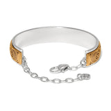 Silver and gold bracelet with chain on a white background