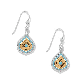 Pair of earrings with decorative designs on a white background