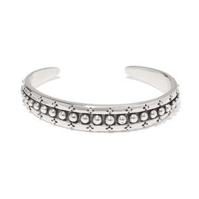 Silver bracelet with bead detailing on a white background
