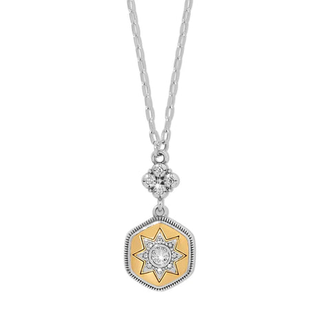Necklace with a gold and silver pendant on a white background