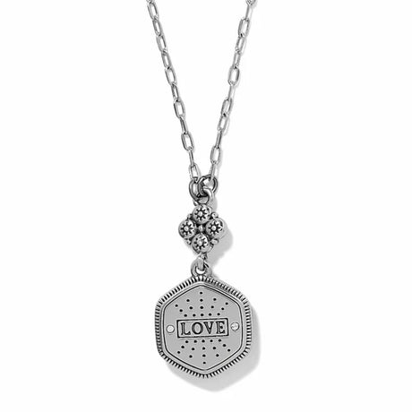 A silver-tone chain necklace featuring a hexagonal pendant engraved with the word 'LOVE' and a small floral cluster charm above it, shown on a plain white background.