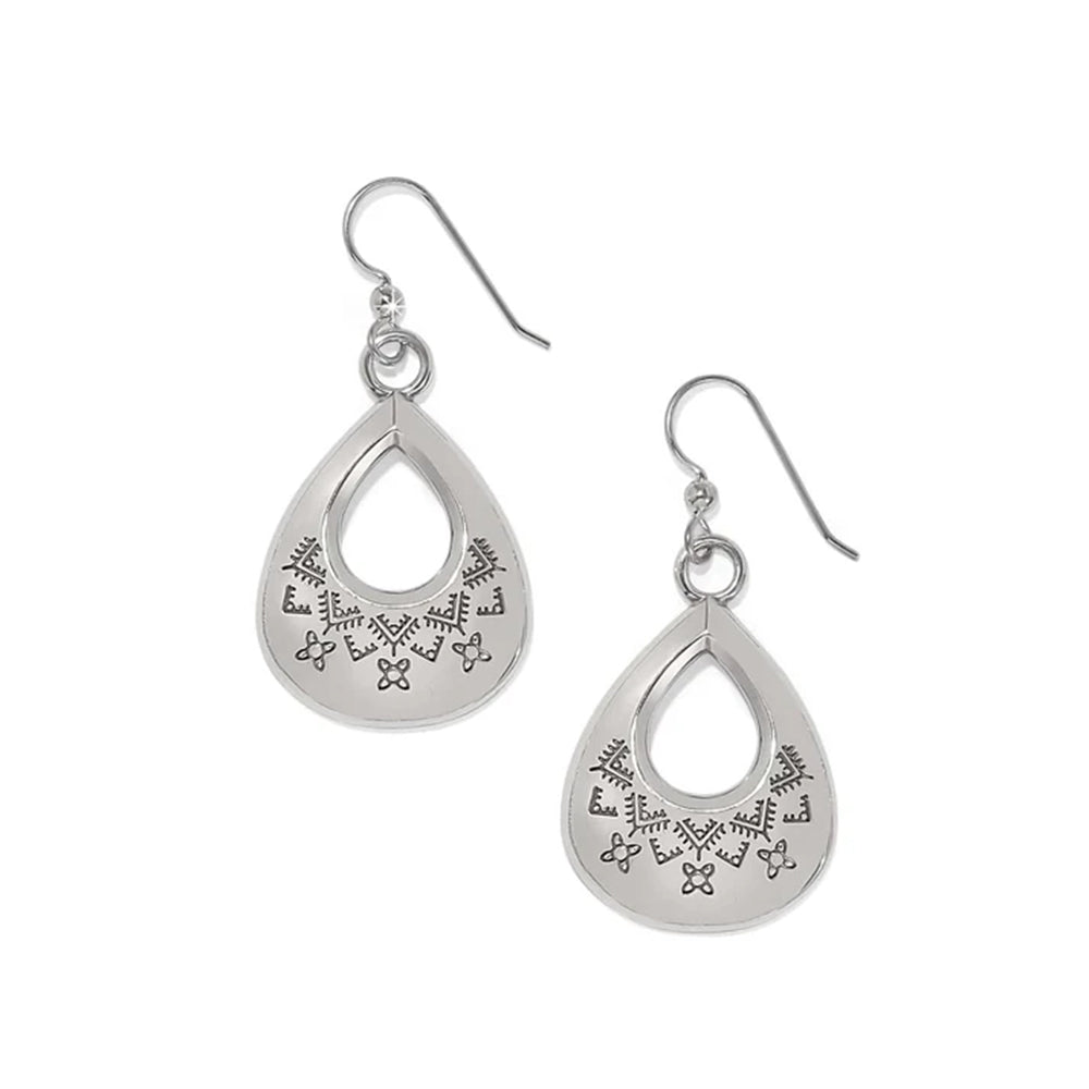 Pair of silver teardrop-shaped earrings with intricate designs on a white background