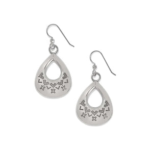 Pair of silver teardrop-shaped earrings with intricate designs on a white background