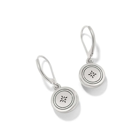 Silver earrings with circular designs on a white background