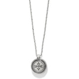 Silver necklace with a round pendant engraved with 'SHINE' on a white background