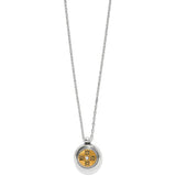Silver necklace with a round pendant featuring a floral design on a white background