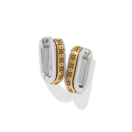 A pair of silver-toned hoop earrings with a central gold-toned band featuring a laser-cut floral pattern, shown on a clean white background.