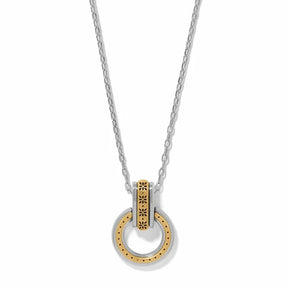 A silver and gold two-tone necklace featuring a circular pendant with a textured gold center and a silver outer ring, suspended from a delicate silver chain on a white background.