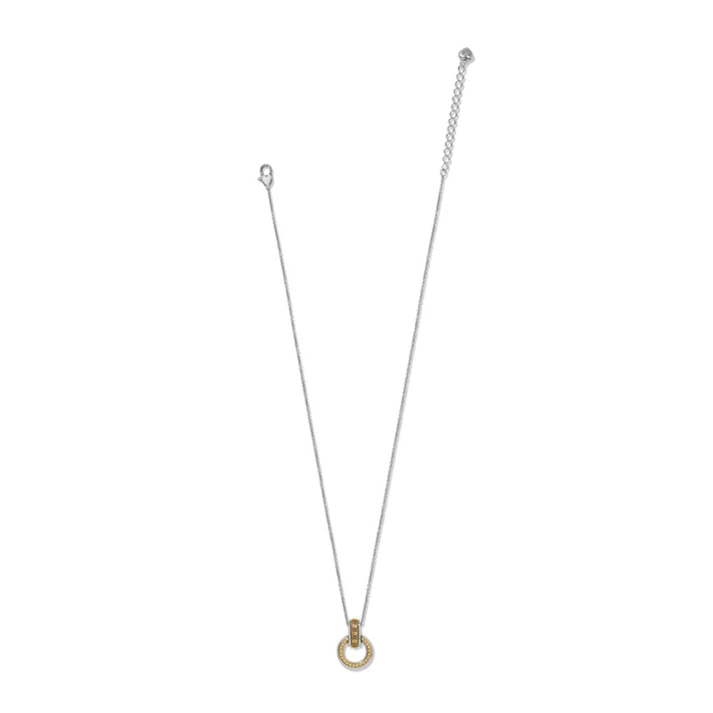 A delicate silver chain necklace with a small gold ring pendant, displayed against a solid white background.