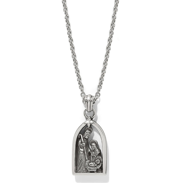 Silver pendant necklace with religious design on a white background