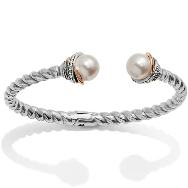 Silver bracelet with two pearls on a white background
