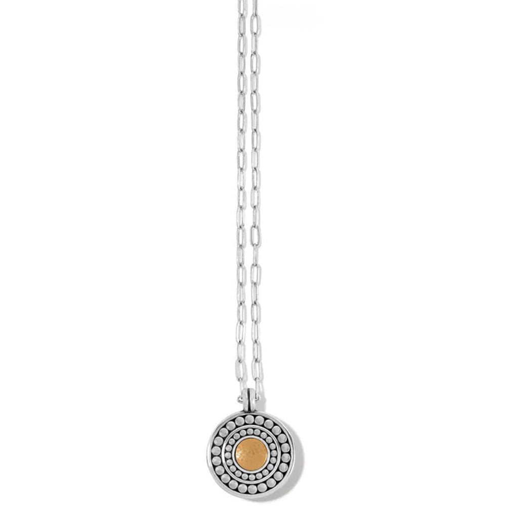 Necklace with a round pendant featuring a gold center on a white background