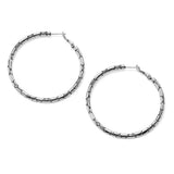 Pair of silver hoop earrings on a white background