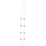 Long necklace with multiple small silver pendants on a white background