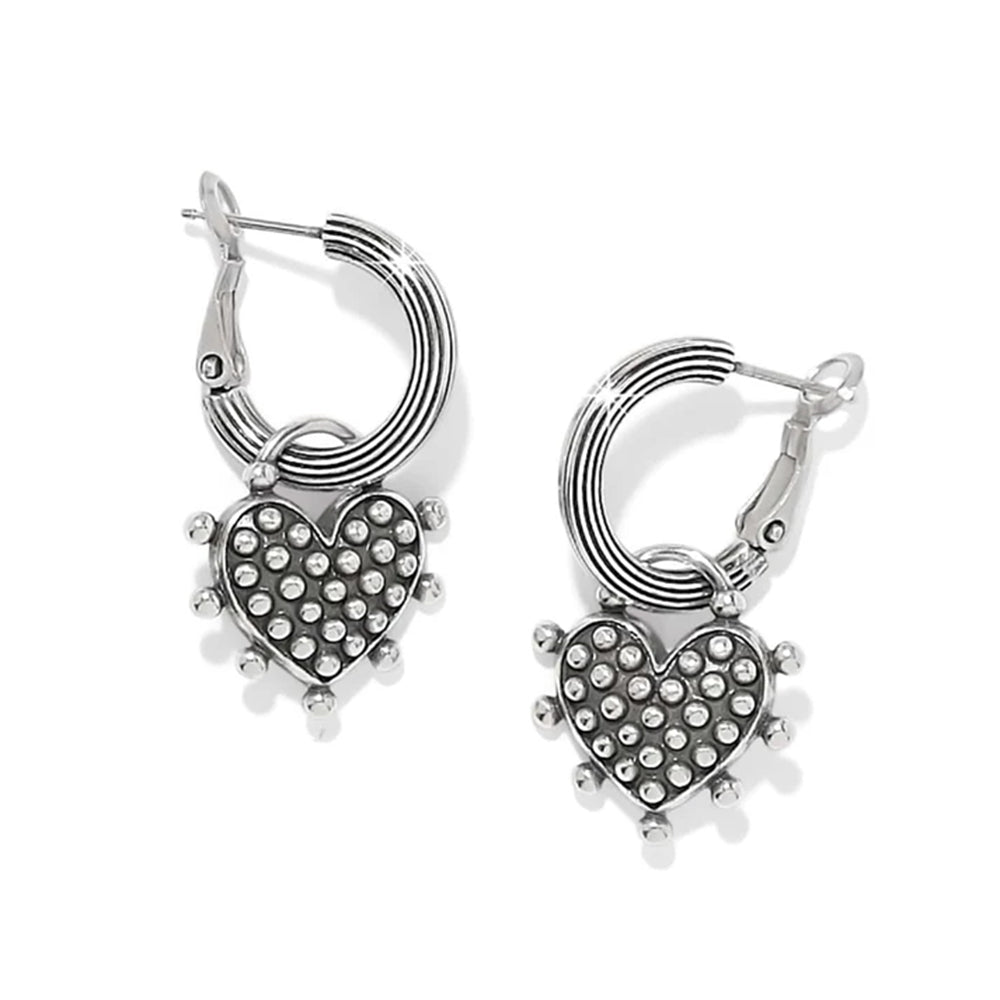 A pair of silver hoop earrings with textured heart-shaped charms covered in small clear rhinestones, shown on a clean white background.