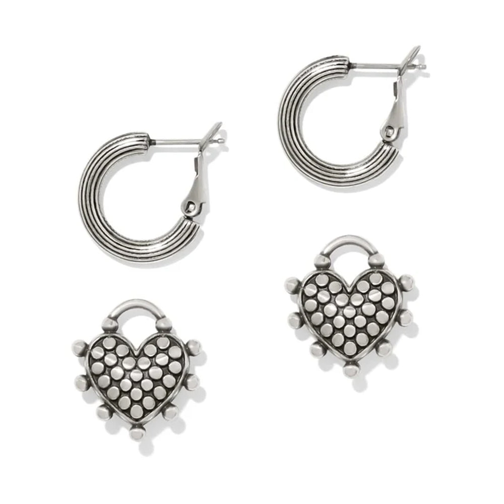 Silver heart-shaped hoop earrings on a white background