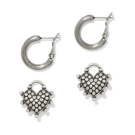 Silver heart-shaped hoop earrings on a white background