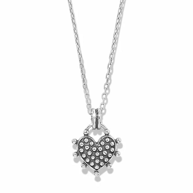 A silver heart-shaped pendant necklace featuring a pavé-set heart with small clear stones and a spiked border, suspended from a delicate silver chain against a white background.
