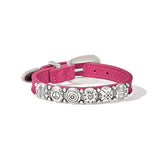 Pink bracelet with decorative metal plate on a white background