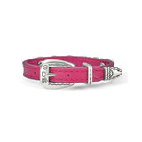 Pink bracelet with decorative metal plate on a white background