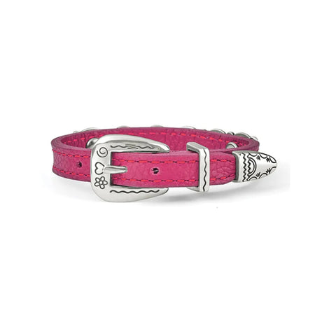Pink bracelet with decorative metal plate on a white background