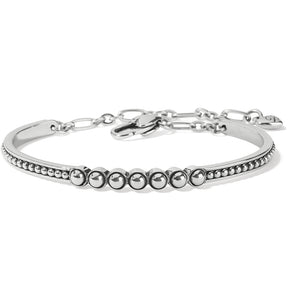 A silver-colored metal bar bracelet with beaded details and a branded clasp.