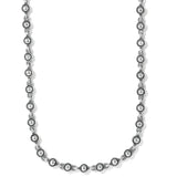 Silver beaded necklace on a white background