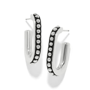 A pair of silver-toned hoop earrings with a curved front edge lined with small round clear stones, shown on a clean white background.