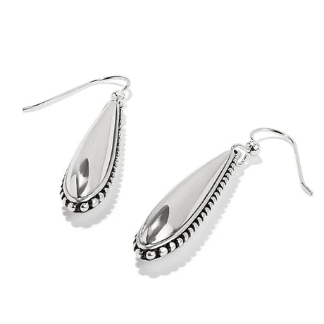 Pair of silver teardrop earrings on a white background