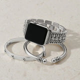 Silver watch band with intricate design on a light beige background