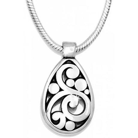 Silver pendant with intricate design on a white background